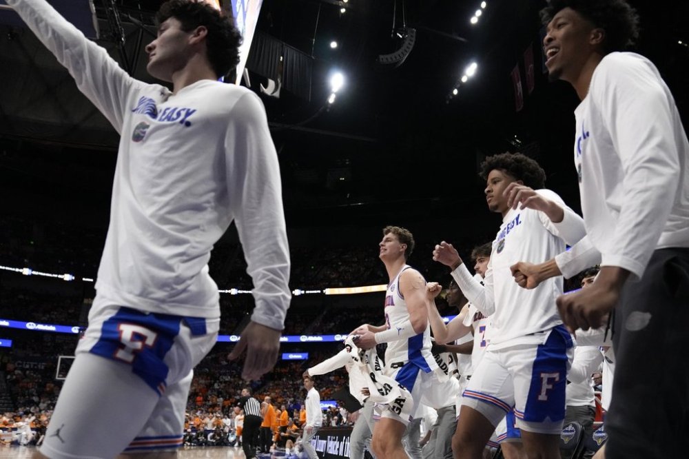 The Florida bench cheers play against Tennessee during the second half of an NCAA college basketball game in the final round of the Southeastern Conference tournament, Sunday, March 16, 2025, in Nashville, Tenn. (AP Photo/George Walker IV)