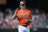 FILE - Baltimore Orioles shortstop Gunnar Henderson waves as he holds the most valuable Oriole award before a baseball game against the Detroit Tigers, Saturday, Sept. 21, 2024, in Baltimore. (AP Photo/Nick Wass, File)