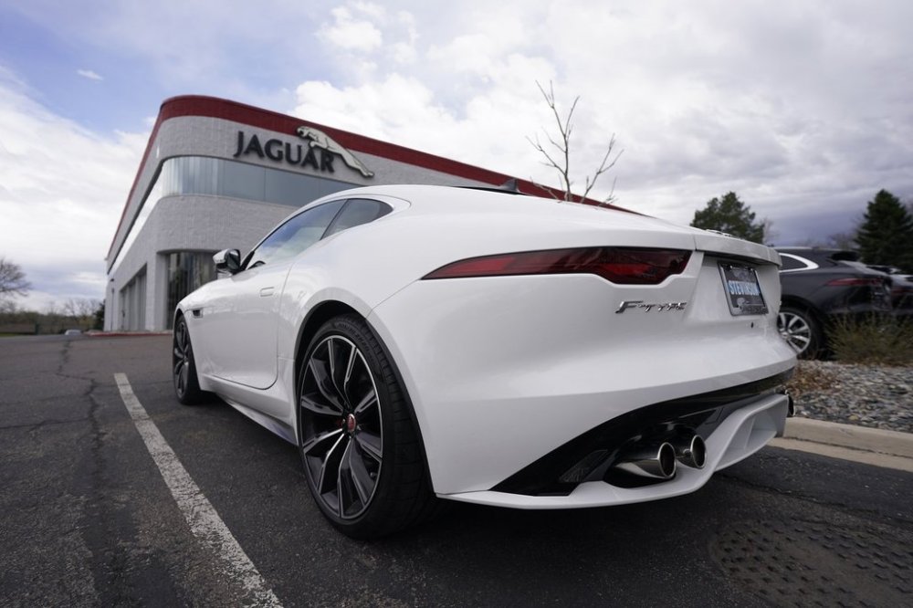 FILE - An unsold 2021 F-Type coupe sits at a Jaguar dealership in this photograph taken Sunday, May 2, 2021, in Littleton, Colo. (AP Photo/David Zalubowski, file)