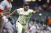 Milwaukee Brewers starting pitcher Nestor Cortes throws out Cincinnati Reds' TJ Friedl (29) during the third inning of a baseball game Thursday, April 3, 2025, in Milwaukee. (AP Photo/Jeffrey Phelps)