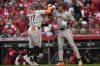 San Francisco Giants' Heliot Ramos (17) homers celebrates his two-run homer with Jung Hoo Lee (51) in the fourth inning of an opening-day baseball game against the Cincinnati Reds, Thursday, March, 27, 2025, in Cincinnati. (AP Photo/Carolyn Kaster)
