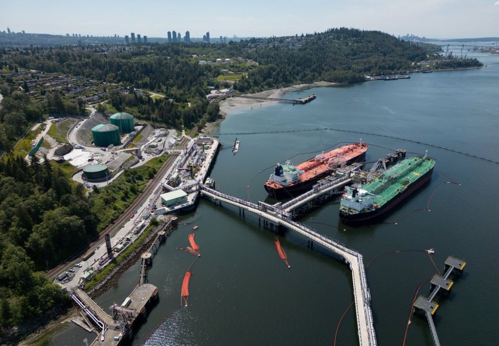 Crude oil tankers SFL Sabine, left, and Tarbet Spirit are seen docked at the Trans Mountain Westridge Marine Terminal, where crude oil from the expanded Trans Mountain Pipeline is loaded onto tankers, in Burnaby, B.C., Monday, June 10, 2024. THE CANADIAN PRESS/Darryl Dyck