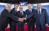 Former Bloc Québécois leader Gilles Duceppe, left to right, then-Liberal leader Justin Trudeau, journalist Pierre Bruneau, then-Conservative leader Stephen Harper and ex-NDP leader Tom Mulcair pose for photos before the start of a French-language debate broadcast by Quebec's TVA network in Montreal on Friday, Oct. 2, 2015. THE CANADIAN PRESS/POOL-Joel Lemay