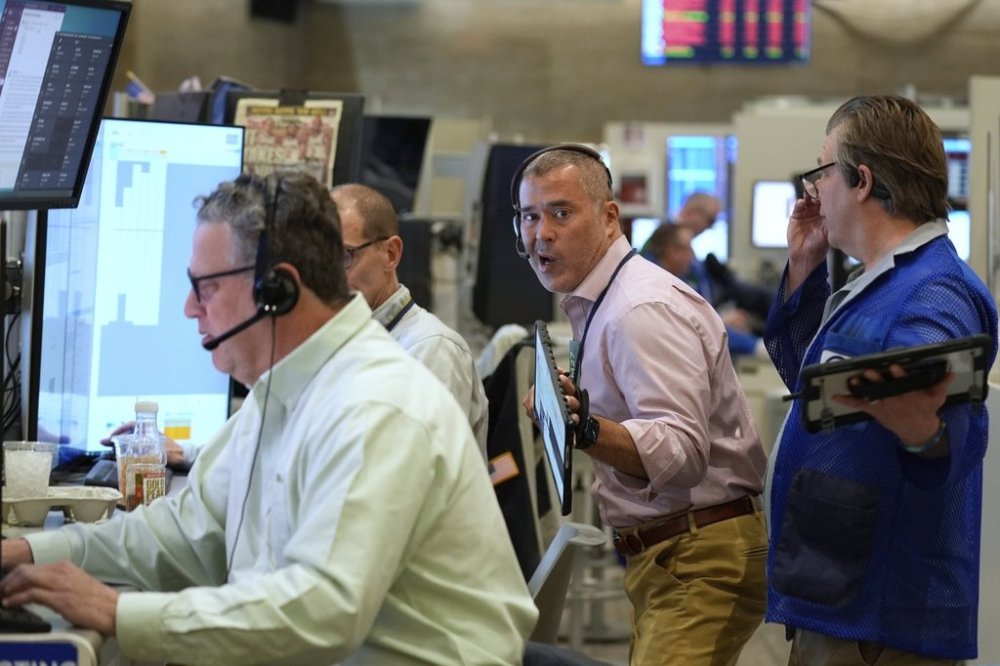 Traders work on the options floor at the New York Stock Exchange in New York, Monday, April 7, 2025. (AP Photo/Seth Wenig)