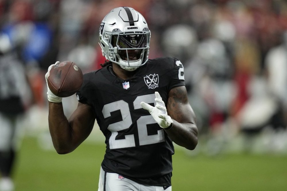 FILE - Las Vegas Raiders running back Alexander Mattison (22) warms up before an NFL football game against the Kansas City Chiefs, Oct. 27, 2024, in Las Vegas. (AP Photo/John Locher, file)