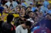 FILE - Uruguay's players argue with fans at the end of a Copa America semifinal soccer match against Colombia in Charlotte, N.C., Wednesday, July 10, 2024. (AP Photo/Julia Nikhinson, file)