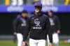 Just called up from Triple A affiliate Albuquerque, Colorado Rockies starting pitcher Chase Dollander warms up before a baseball game against the Athletics, Saturday, April 5, 2025, in Denver. (AP Photo/David Zalubowski)