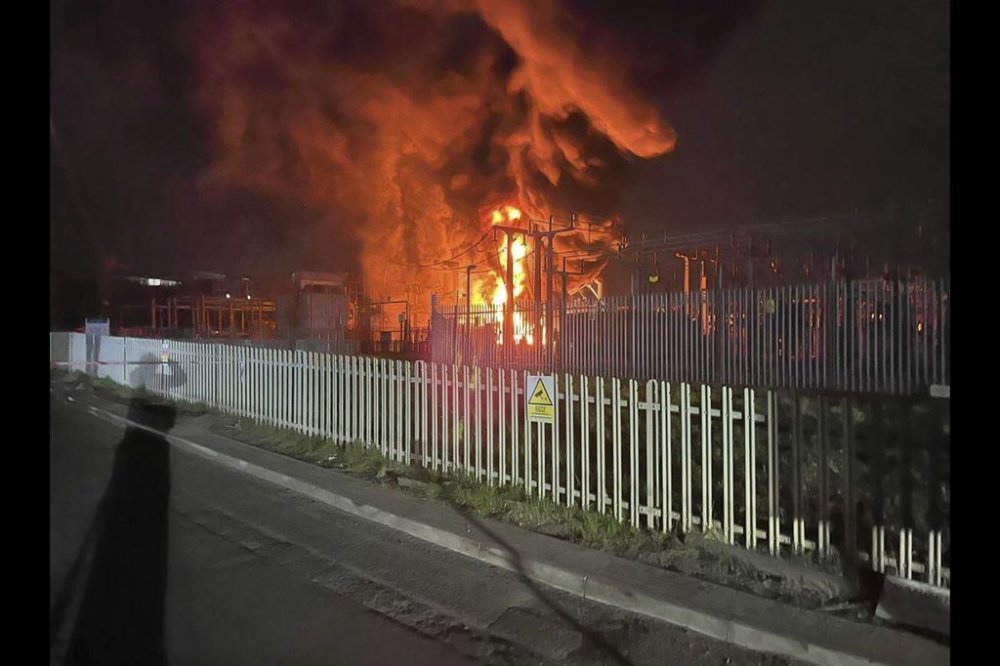 This photo provided by London Fire Brigade, shows a fire at the North Hyde electrical substation, which caught fire Thursday night and lead to a closure of Heathrow Airport in London, Friday, March 21 2025. (London Fire Brigade via AP)
