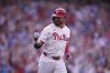 Philadelphia Phillies' Kyle Schwarber reacts after hitting a two-run home run off Colorado Rockies pitcher Victor Vodnik during the seventh inning of the Phillies' home-opener baseball game, Monday, March 31, 2025, in Philadelphia. (AP Photo/Matt Rourke)