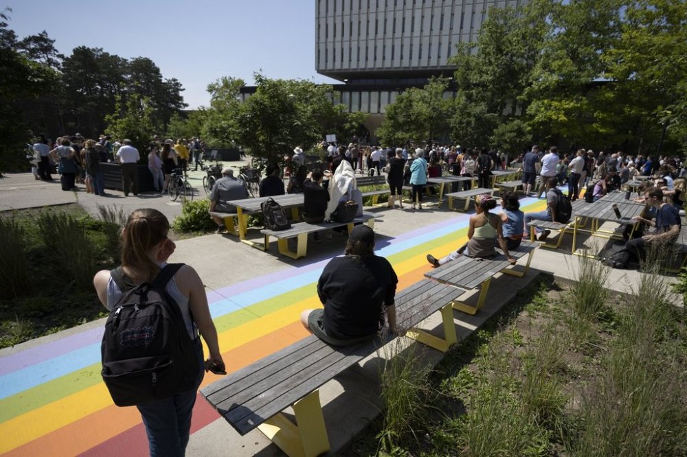The University of Waterloo campus community gathers in the Arts Quad for a vigil in Waterloo, Ont., Thursday, June 29, 2023. THE CANADIAN PRESS/Nicole Osborne