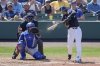 Detroit Tigers shortstop Javier Baez, right, hits a double against the Toronto Blue Jays in the fourth inning of a spring training baseball game, Monday, March 3, 2025, in Lakeland, Fla. (AP Photo/John Raoux)