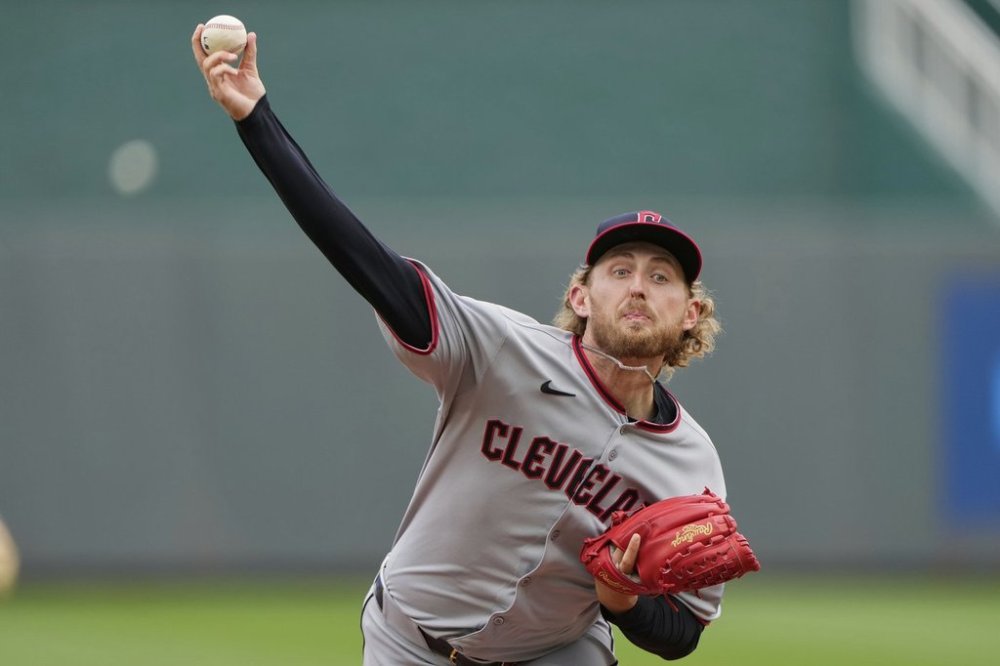 Cleveland Guardians starting pitcher Tanner Bibee throws during the first inning of a baseball game against the Kansas City Royals, Sunday, March 30, 2025, in Kansas City, Mo. (AP Photo/Charlie Riedel)