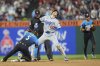 Los Angeles Dodgers' Shohei Ohtani reacts after Philadelphia Phillies second baseman Bryson Stott tagged him out attempting to steal second during the eighth inning of a baseball game, Friday, April 4, 2025, in Philadelphia. (AP Photo/Matt Rourke)