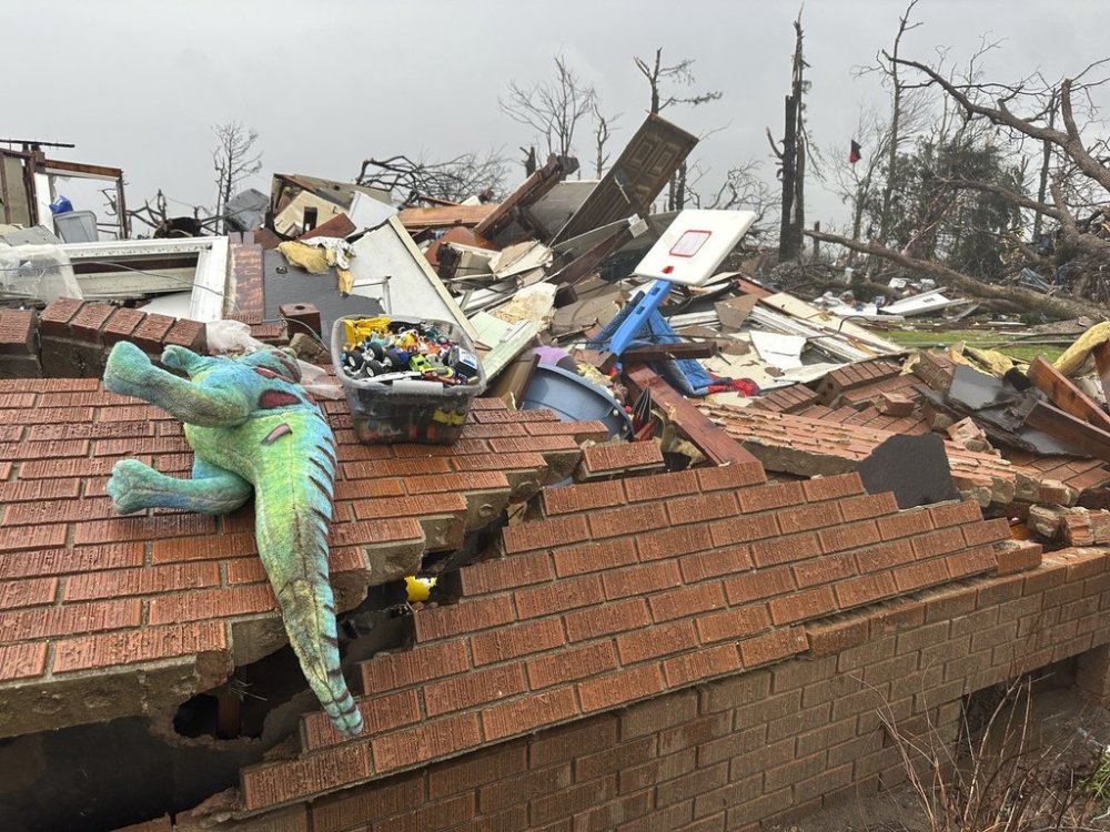 Debris covers a home at Lake City, Ark., on Thursday, April 3, 2025. (AP Photo/Adrian Sainz)