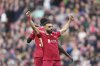Liverpool's Mohamed Salah celebrates after scoring his side's third goal during the English Premier League soccer match between Liverpool and Southampton at Anfield in Liverpool, Saturday, March 8, 2025. (AP Photo/Jon Super)