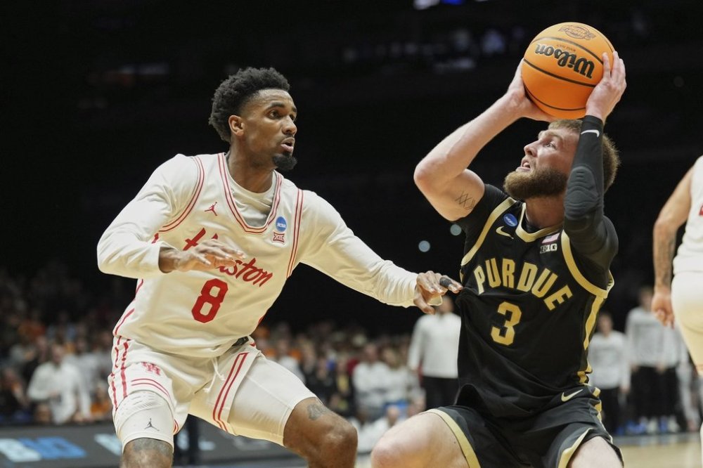 Purdue's Braden Smith (3) looks to the basket as Houston's Mylik Wilson (8) defends during the first half in the Sweet 16 of the NCAA college basketball tournament Friday, March 28, 2025, in Indianapolis. (AP Photo/AJ Mast)