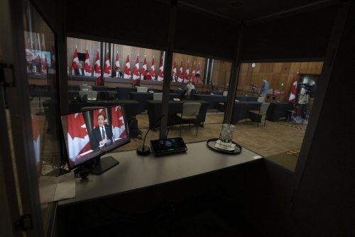 An empty translation booth is seen during a news conference in the Parliamentary precinct on Monday, Nov. 14, 2022 in Ottawa. THE CANADIAN PRESS/Adrian Wyld