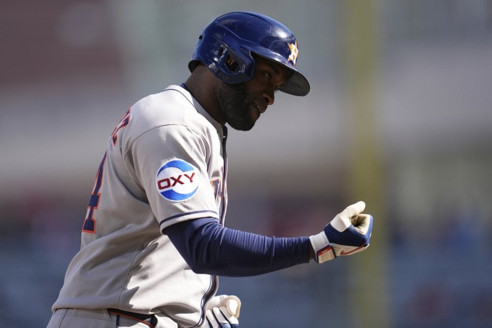 Houston Astros' Yordan Alvarez (44) runs the bases after hitting a two-run home run during the ninth inning of a baseball game against the Minnesota Twins, Sunday, April 6, 2025, in Minneapolis. (AP Photo/Abbie Parr)