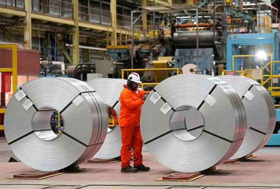 A steel worker works at the ArcelorMittal Dofasco steel plant in Hamilton, Ont., earlier this month. (Nathan Denette / The Canadian Press)