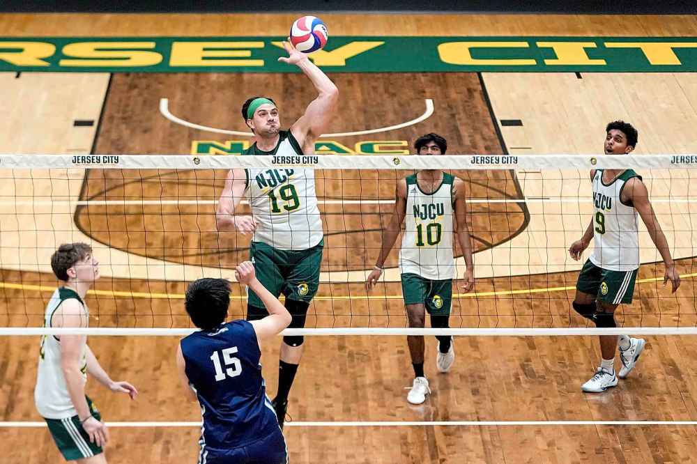 Damon LaSalle (19) blocks against University of Mount Saint Vincent's Yi Wang (15) during a men's NCAA Division III college volleyball game, Wednesday, March 5, 2025, at New Jersey City University in Jersey City, N.J. (AP Photo/Julia Demaree Nikhinson)