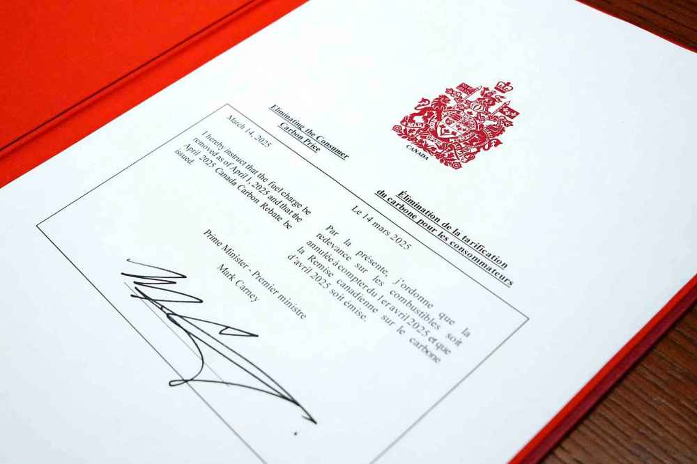 An order-in-council to eliminate the consumer carbon price, signed by Prime Minister Mark Carney, is shown on Parliament Hill in Ottawa on Friday, March 14, 2025. THE CANADIAN PRESS/Justin Tang