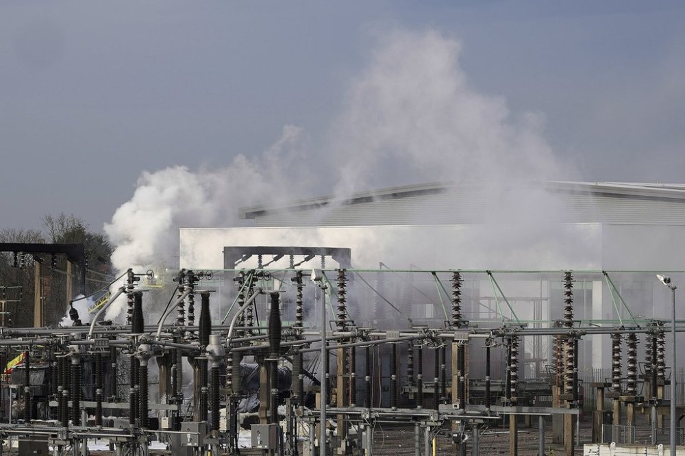 Firefighters extinguish the fire at the North Hyde electrical substation, which caught fire Thursday night and lead to a closure of Heathrow Airport in London, Friday, March 21, 2025.(AP Photo/Kirsty Wigglesworth)