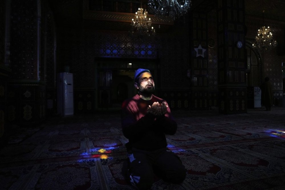 A Kashmiri Muslim man prays inside the shrine of Sheikh Abdul Qadir Jeelani, commonly known as Dastageer Sahib, in Srinagar, Indian controlled Kashmir, Wednesday, April 2, 2025. (AP Photo/Mukhtar Khan)