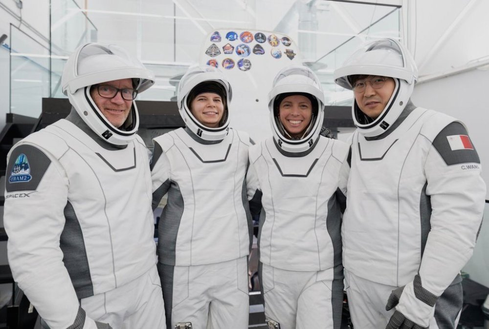 In this image provided by SpaceX shows from left: Eric Philips, a polar guide from Australia; Rabea Rogge, a robotics researcher from Germany; Norwegian filmmaker Jannicke Mikkelsen and Chun Wang, a Chinese-born bitcoin investor who is paying for the whole spaceflight and now lives in Malta. (SpaceX via AP)