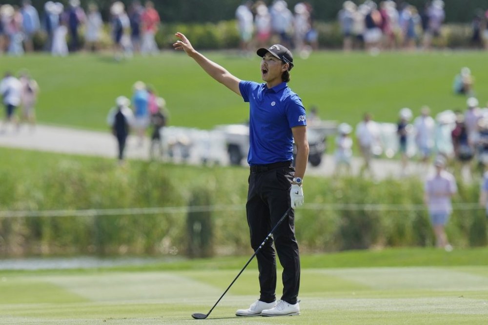 Min Woo Lee yells after hitting his second shot on the ninth hole during the second round of The Players Championship golf tournament Friday, March 14, 2025, in Ponte Vedra Beach, Fla. (AP Photo/Chris O'Meara)