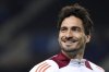 FILE - Roma's Mats Hummels smiles when walking on to the pitch for the warmup before the Europa League playoff first leg soccer match between FC Porto and AS Roma at the Dragao stadium in Porto, Portugal, Thursday, Feb. 13, 2025. (AP Photo/Luis Vieira, File)