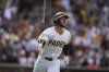 San Diego Padres' Jackson Merrill watches his two-run home run during the fourth inning of a baseball game against the Cleveland Guardians 307Wednesday, April 2, 2025, in San Diego. (AP Photo/Gregory Bull)