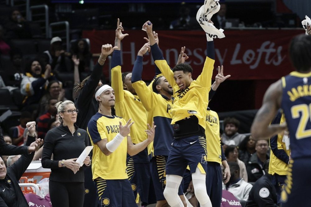 Indiana Pacers bench celebrates a made three point basket scored by guard Ben Sheppard, not pictured, during the second half of an NBA basketball game against the Washington Wizards, Thursday, March 27, 2025, in Washington. (AP Photo/Terrance Williams)