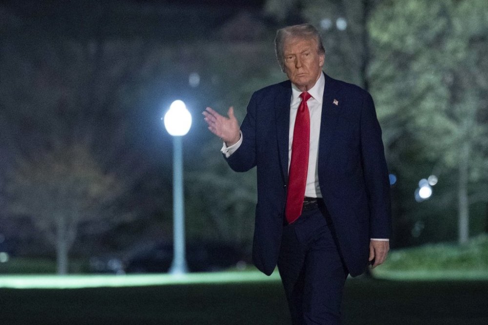 President Donald Trump waves to the media as he walks on the South Lawn of the White House in Washington on March 30, 2025. THE CANADIAN PRESS/AP, Jose Luis Magana