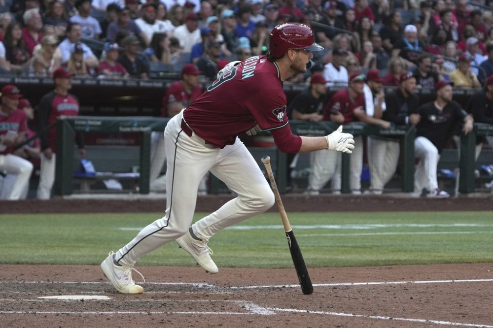 Arizona Diamondbacks' Ryne Nelson hits an RBI single against the Chicago Cubs in the eighth inning during a baseball game, Sunday, March 30, 2025, in Phoenix. (AP Photo/Rick Scuteri)