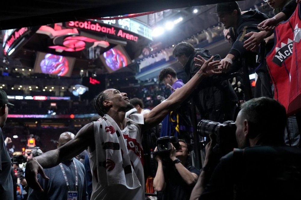 Toronto Raptors guard A.J. Lawson (0) leaves the court following sinking a three-pointer for a career high following second half NBA basketball action against the Washington Wizards, in Toronto, Monday, March 10, 2025. THE CANADIAN PRESS/Nathan Denette