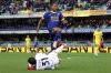Parma goalkeeper Zion Suzuki grabs the ball ahead of Verona's Ami Sarr during the Serie A soccer match between Hellas Verona and Parma at the Marcantonio Bentegodi Stadium, in Verona, Italy, Monday, March 31, 2025. (Paola Garbuio/LaPresse via AP)