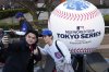 Fans of the Chicago Cubs take selfie at the Tokyo Dome ahead of an MLB Tokyo Series baseball game between the Los Angeles Dodgers and the Chicago Cubs, in Tokyo, Tuesday, March 18, 2025. (AP Photo/Shuji Kajiyama)