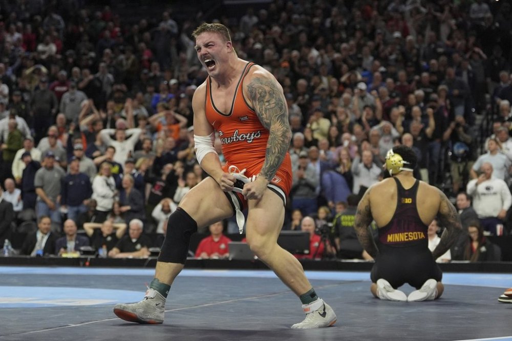 Oklahoma State's Wyatt Hendrickson reacts after defeating Minnesota's Gable Steveson during a 285-pound match in the finals at the NCAA wrestling championship, Saturday, March 22, 2025, in Philadelphia. (AP Photo/Matt Rourke)
