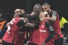 Leverkusen players celebrate after a goal during the German Bundesliga soccer match between Bayer Leverkusen and VfL Bochum at the BayArena in Leverkusen, Germany, Friday, March 28, 2025. (AP Photo/Martin Meissner)