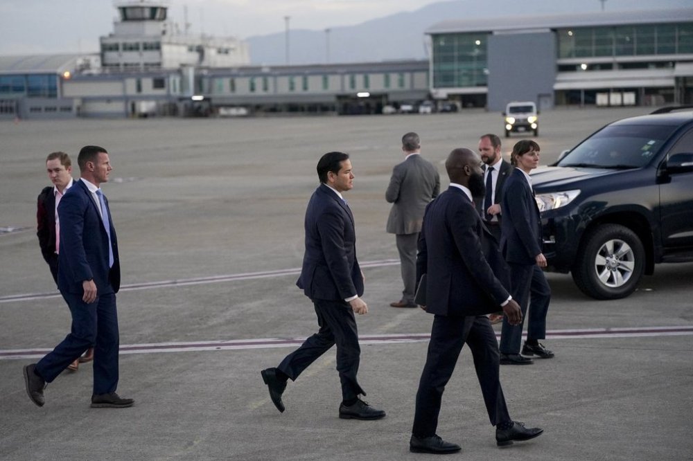 U.S. Secretary of State Marco Rubio walks toward a plane en route to Georgetown, Guyana, as he departs from Norman Manley International Airport in Kingston, Jamaica, Thursday, March 27, 2025. (Nathan Howard/Pool photo via AP)