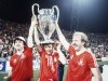 FILE - Nottingham Forest's John Robertson, left, Ian Bowyer, center, and Kenny Burns, right, carry the European Cup in triumph after their 1-0 win against Malmo FF in Munich, Germany, May 30, 1979. (AP Photo, File)