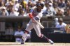 Atlanta Braves' Ozzie Albies hits into a force out during the first inning of an opening-day baseball game against the San Diego Padres Thursday, March 27, 2025, in San Diego. Atlanta Braves' Jurickson Profar scored from third base on the play. (AP Photo/Gregory Bull)