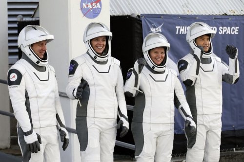 Crew10 members, from left, cosmonaut Kirill Peskov, astronaut Nichole Ayers, astronaut Anne McClain and JAXA astronaut Takuya Onishi leave the Operations and Checkout building before heading to Launch Pad 39-A at the Kennedy Space Center in Cape Canaveral, Fla., for a mission to the International Space Station in Cape Canaveral, Fla., Friday, March 14, 2025. (AP Photo/Terry Renna)