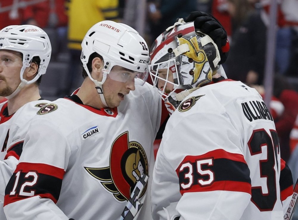 Ottawa Senators center Shane Pinto (12) celebrates with goaltender Linus Ullmark (35) after a win over the Detroit Red Wings in an NHL hockey game Thursday, March 27, 2025, in Detroit. (AP Photo/Duane Burleson)