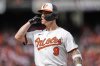 Baltimore Orioles' Tyler O'Neill celebrates after hitting an RBI single during the first inning of an opening-day baseball game against the Boston Red Sox, Monday, March 31, 2025, in Baltimore. (AP Photo/Stephanie Scarbrough)