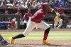 Arizona Diamondbacks' Geraldo Perdomo lays down a sacrifice bunt against the Chicago Cubs in the fifth inning during a baseball game, Sunday, March 30, 2025, in Phoenix. (AP Photo/Rick Scuteri)