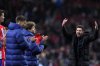 Atletico Madrid's head coach Diego Simeone gestures while te players applaud the fans at the end of the Champions League round of 16, second leg, soccer match between Atletico Madrid and Real Madrid at the Metropolitano stadium in Madrid, Spain, Wednesday, March 12, 2025. (AP Photo/Manu Fernandez)