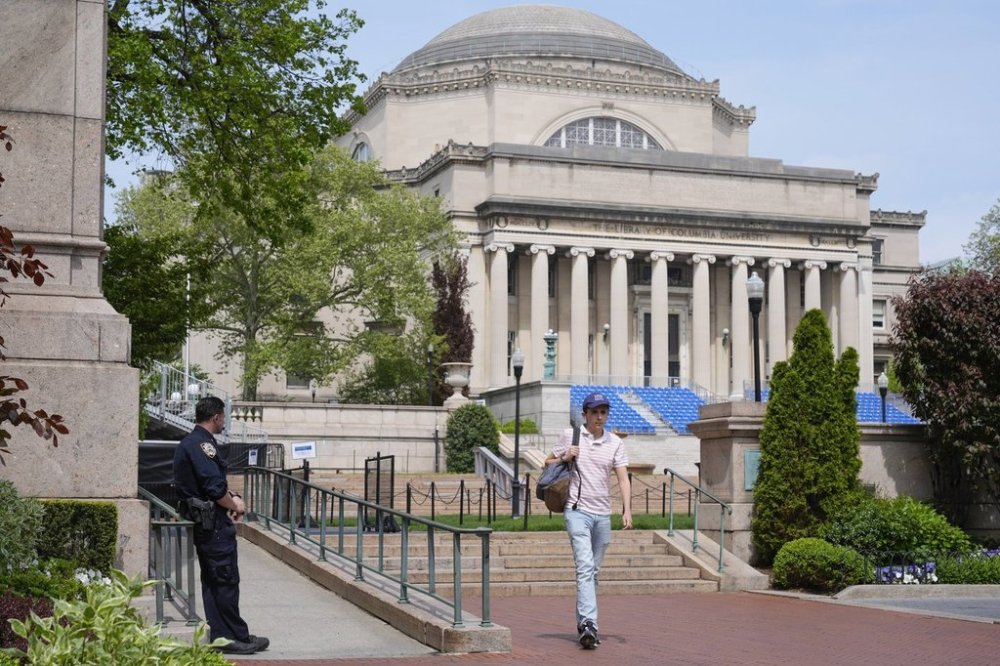 FILE - A New York City police officer keeps watch on the campus of Columbia University in New York, Monday, May 6, 2024. (AP Photo/Seth Wenig, File)