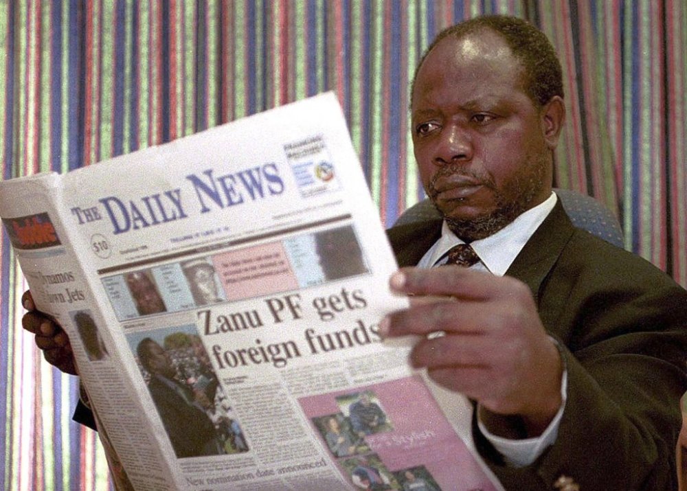 FILE - Geoffrey Nyarota, editor-in-chief of Zimbabwe's independent Daily News newspaper is seen in his Harare office, in this May 26, 2000 photo. (AP Photo/Rob Cooper, file)