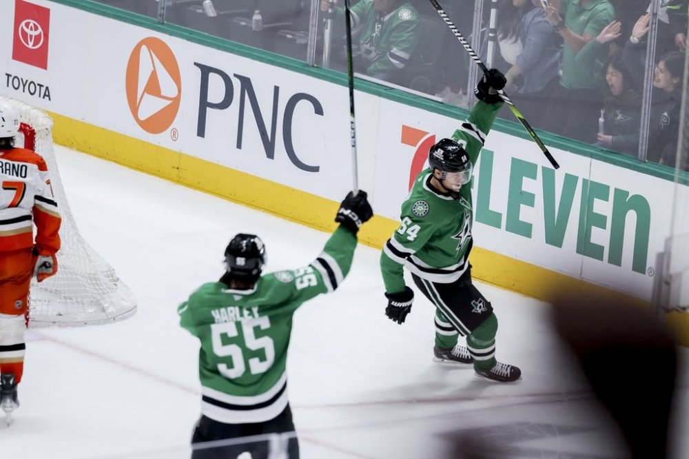 Dallas Stars center Mikael Granlund (64) celebrates after scoring in overtime against the Anaheim Ducks during an NHL hockey game in Dallas, Tuesday, March 18, 2025. (AP Photo/Gareth Patterson)